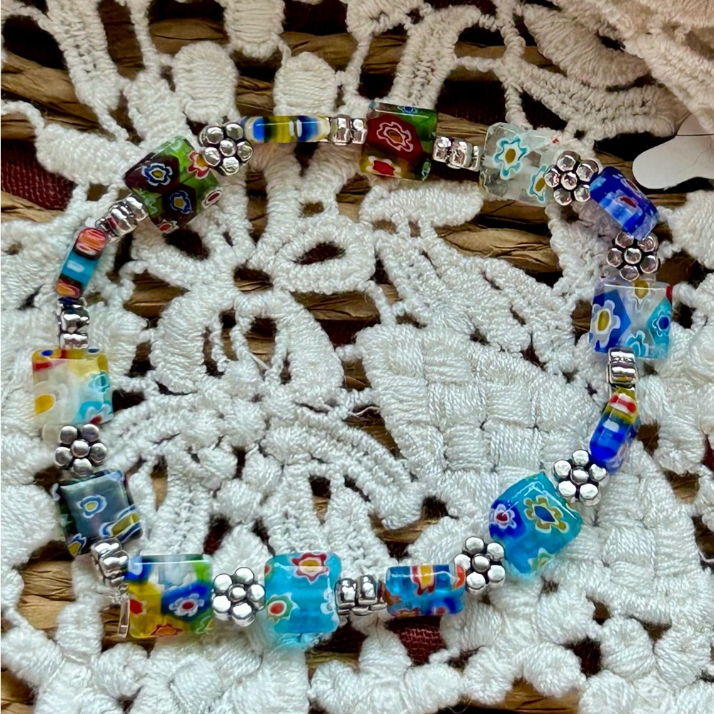 Millefiori glass beaded bracelet with silver flower accents